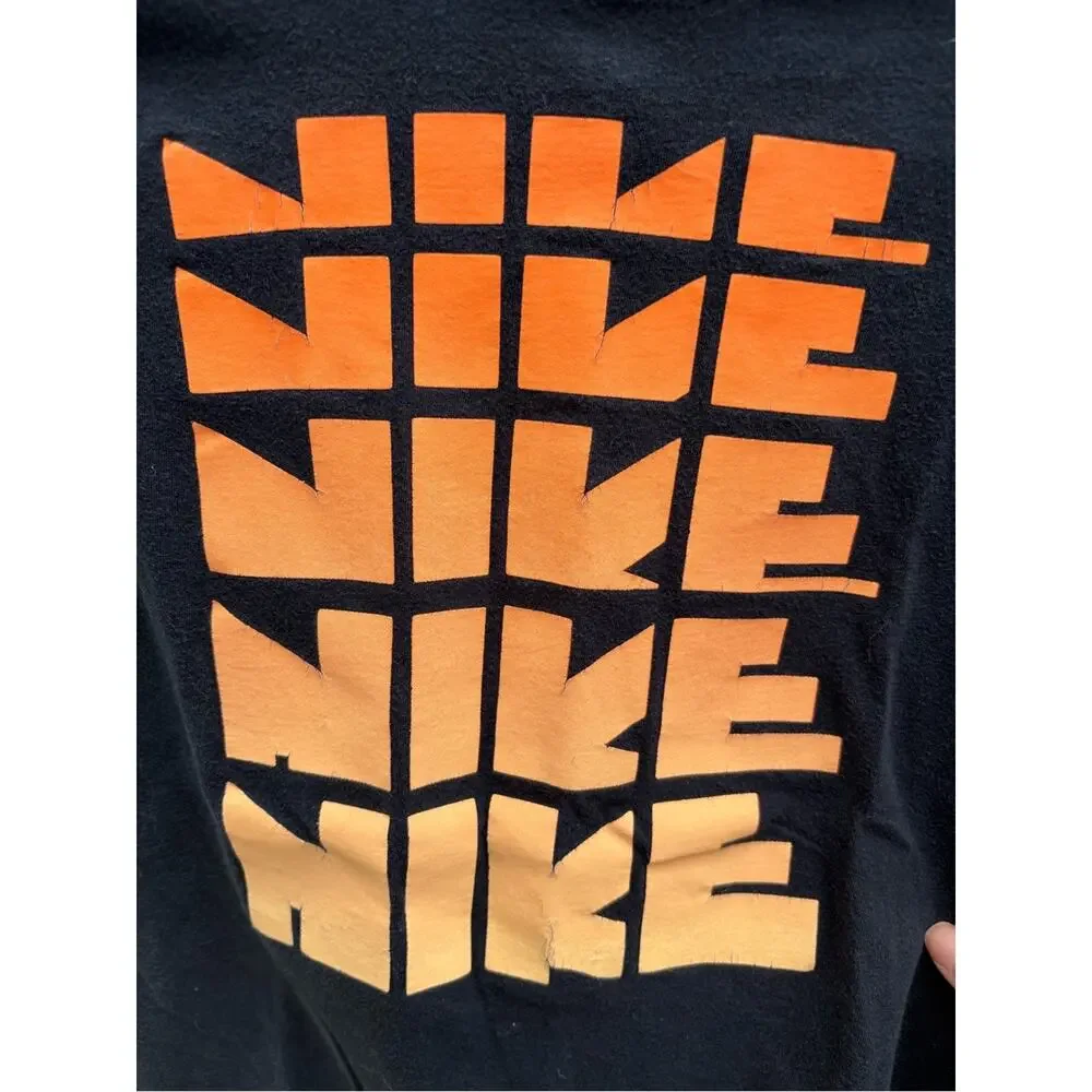 Nike Boys Black Tee with Orange-to-Yellow Stacked Logo- size M